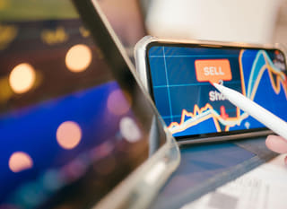Trader examining Bitcoin Ethereum and forex options across multiple markets
